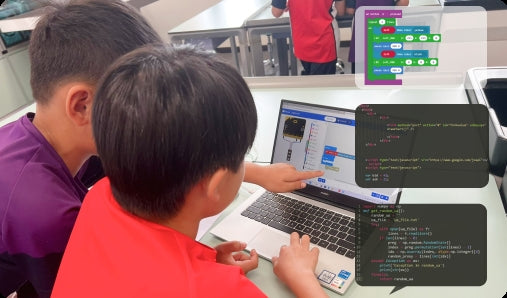 Children learning to program Nezha coding robotic kit using MakeCode and Python on a laptop in classroom