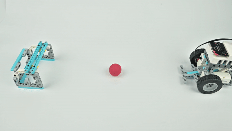 DIY robot kit example project showing a sports robot pushing a ball towards a goal, designed for interactive coding, robotics challenges, and STEM learning