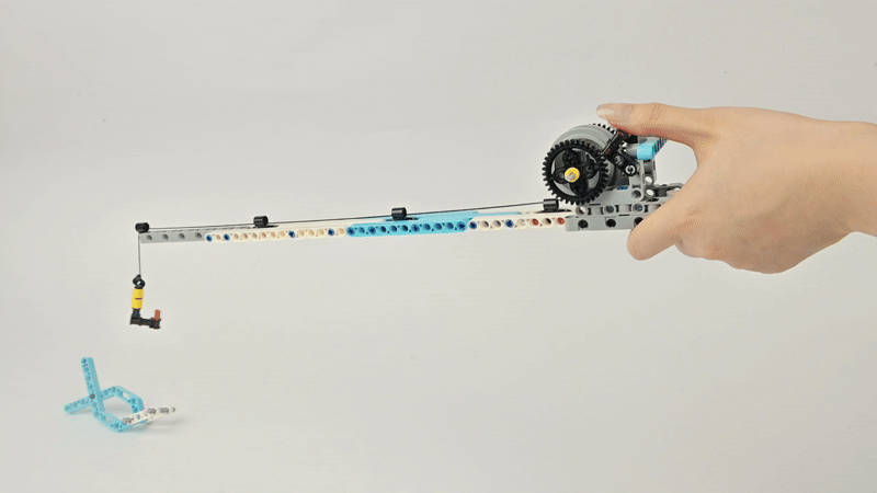 Steam Robotics Kit 110 fishing rod project built with gears and hook demonstrating STEM learning case