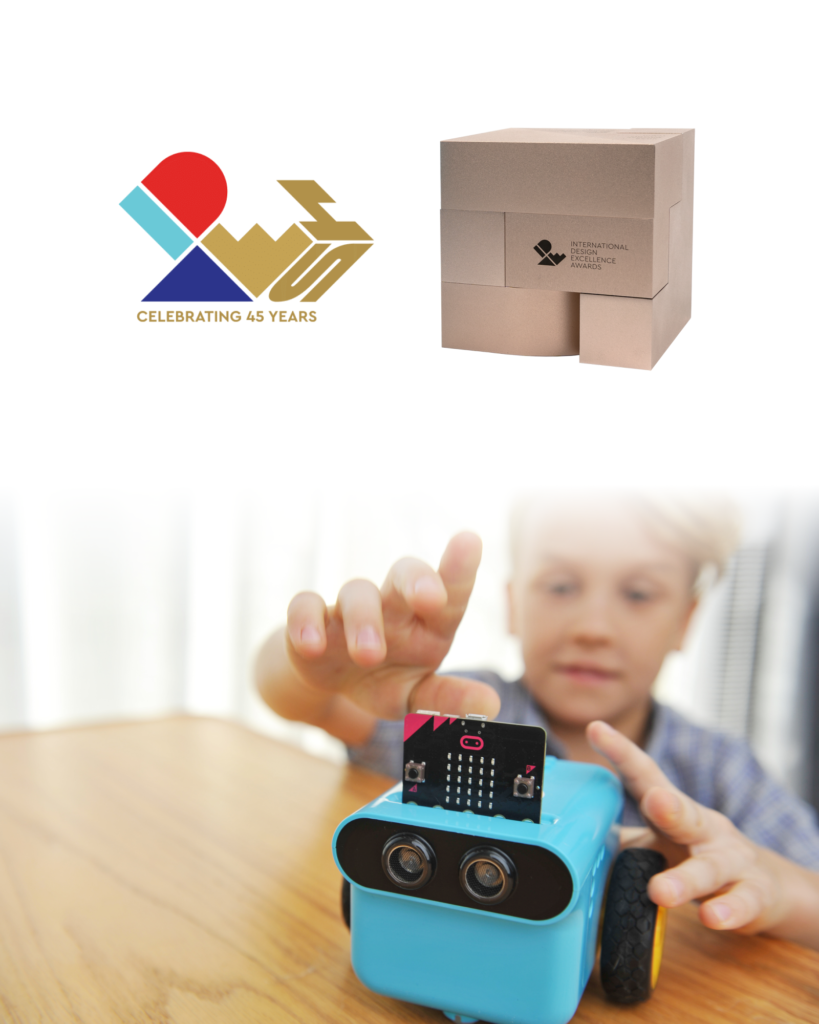 ELECFREAKS microbit TPBot Edu Car Kit winning the American IDEA Design Bronze Award, showing the award logo, trophy box, and a child playing with the TPBot Edu Car
